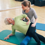 Physical,Therapists,Assisting,Senior,Woman,To,Perform,Myofascial,Release,Technique